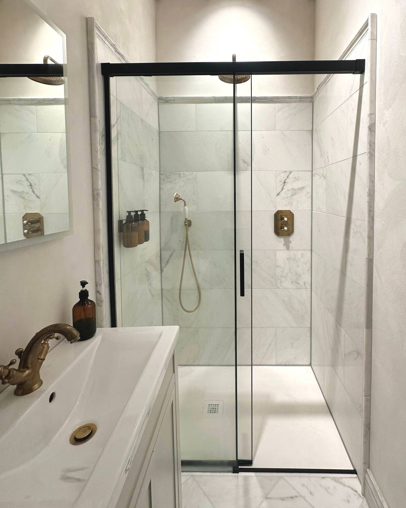 19. Sleek Serenity: a Modern Marble Oasis with Bold Black Accents