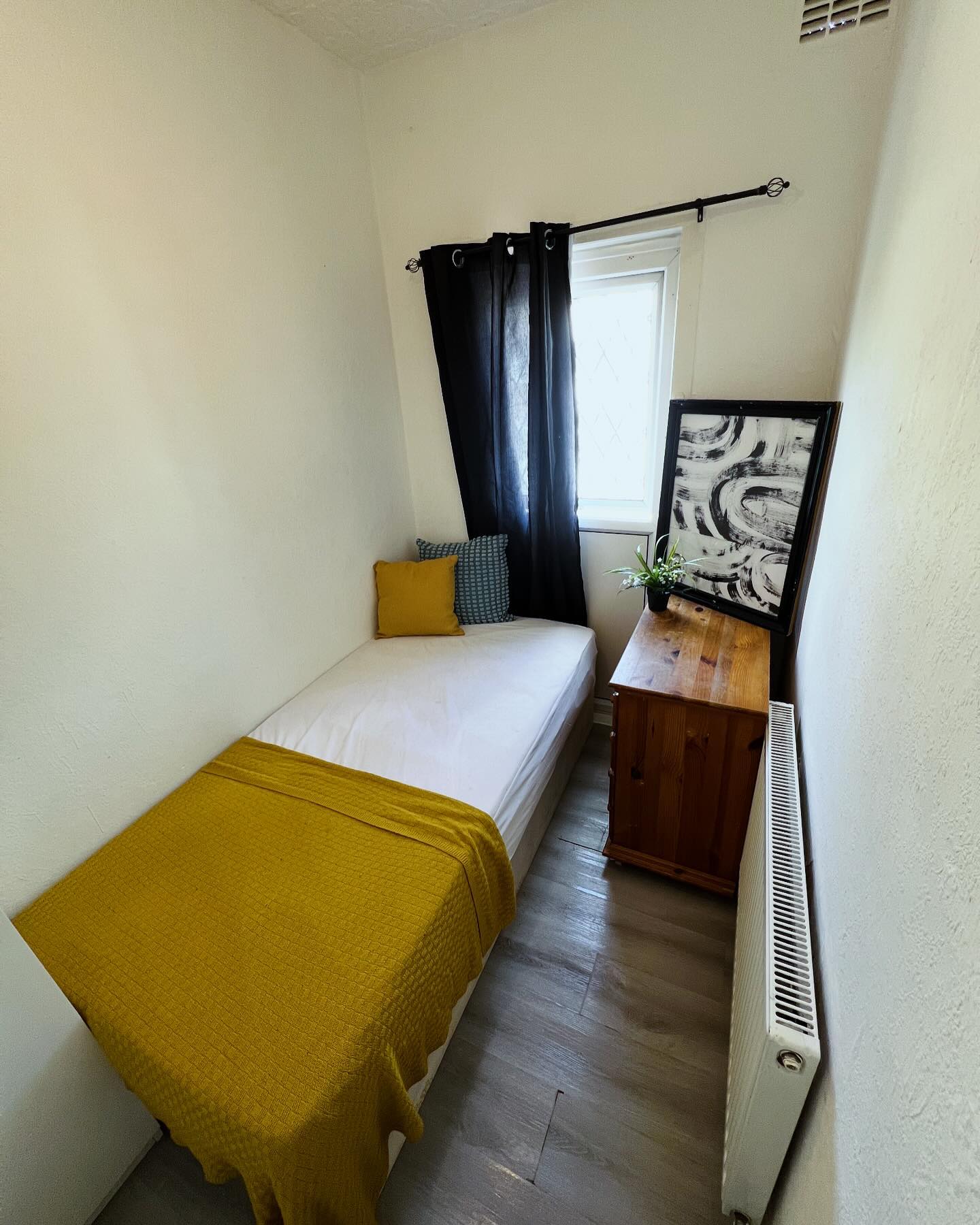 3. Moonlit Dreamscape: a Single Bed Beneath a Glowing Orb Light