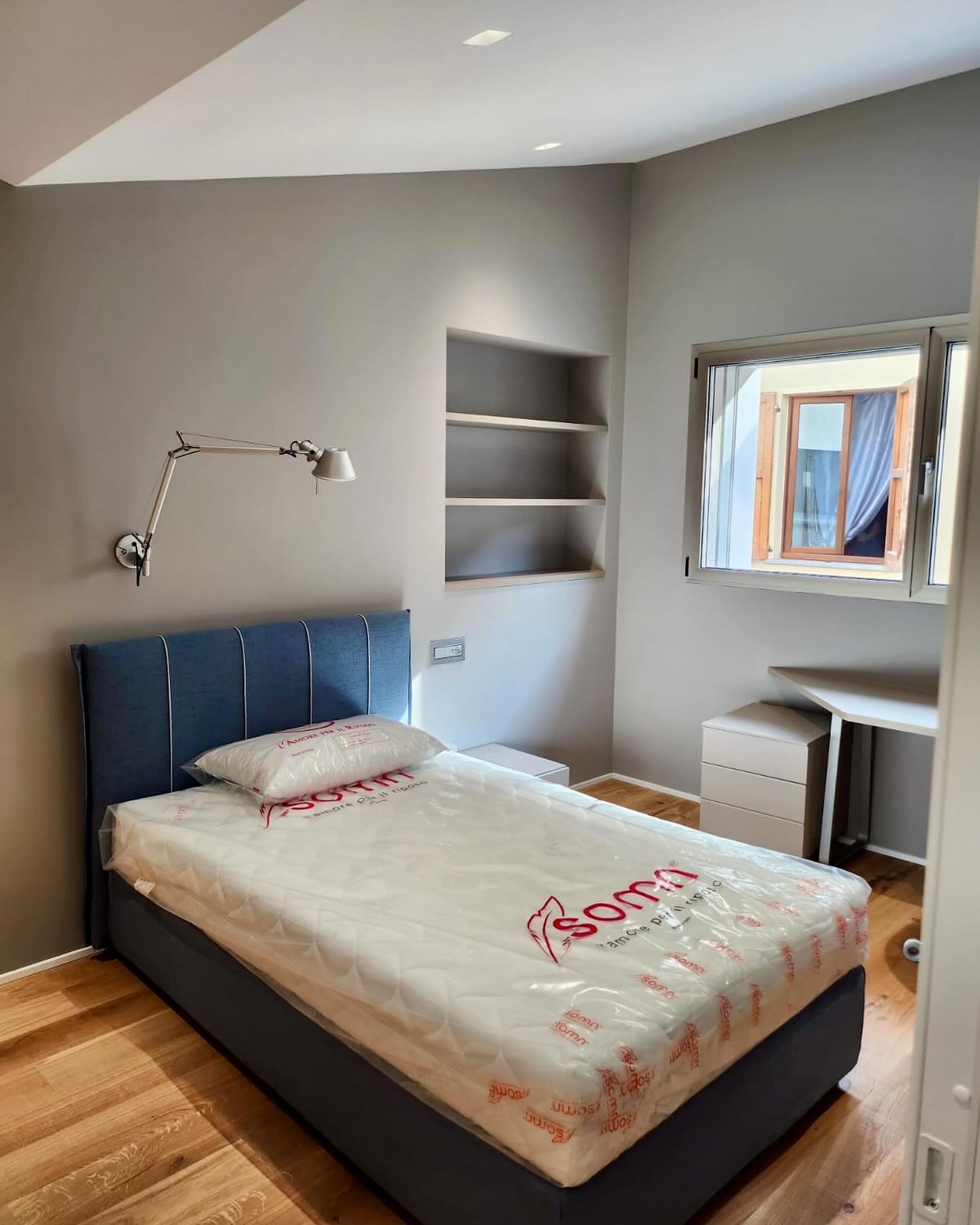 22. Soft Lavender Hues and Geometric Quilt Patterns In a Cozy Corner Nook