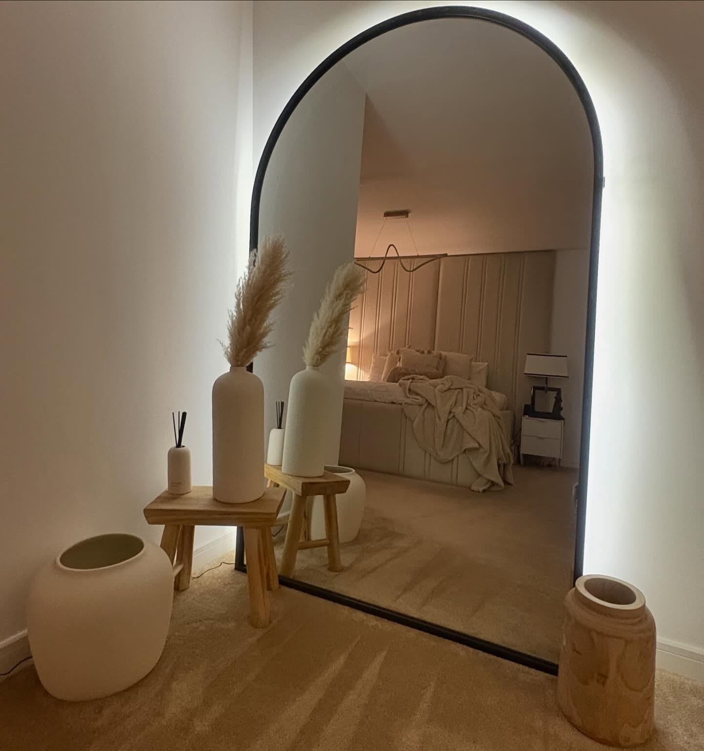 37. Moonlit Oval Mirror with Gilded Frame Reflecting Vintage Charm