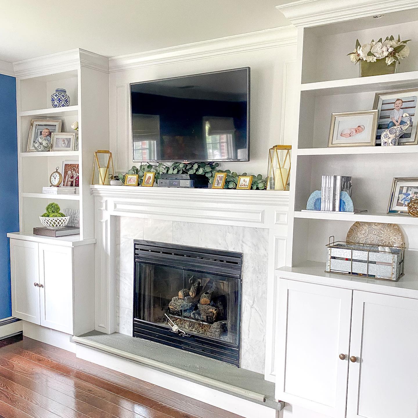 17. Elevated Elegance: Harmonizing a Modern Fireplace with Timeless Décor