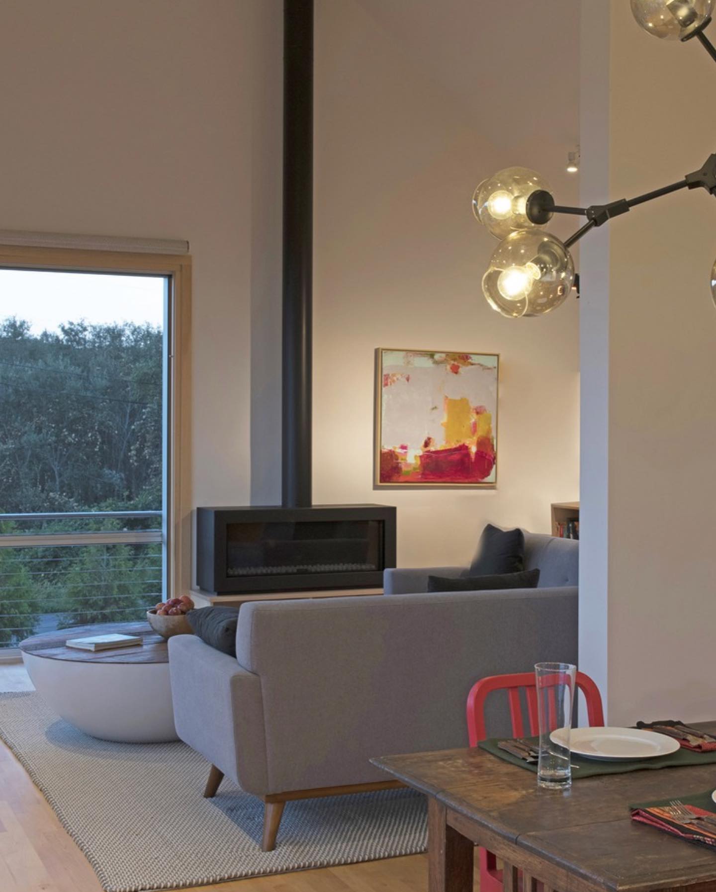 45. Elevated Serenity: a Modern Living Room with Unexpected Artistic Flair