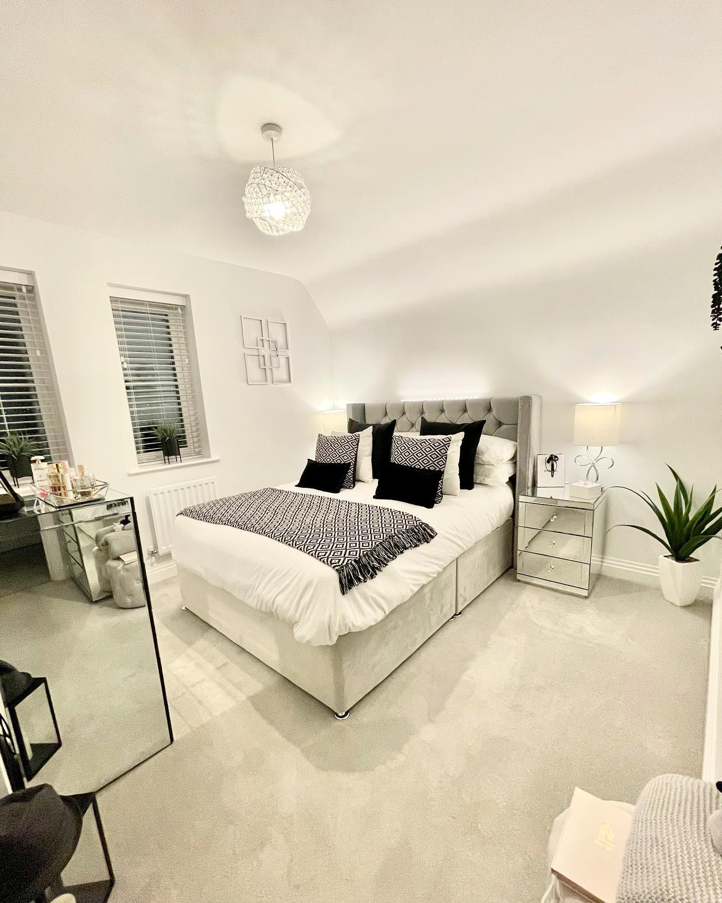 44. Chic Monochrome Oasis with Textured Accents