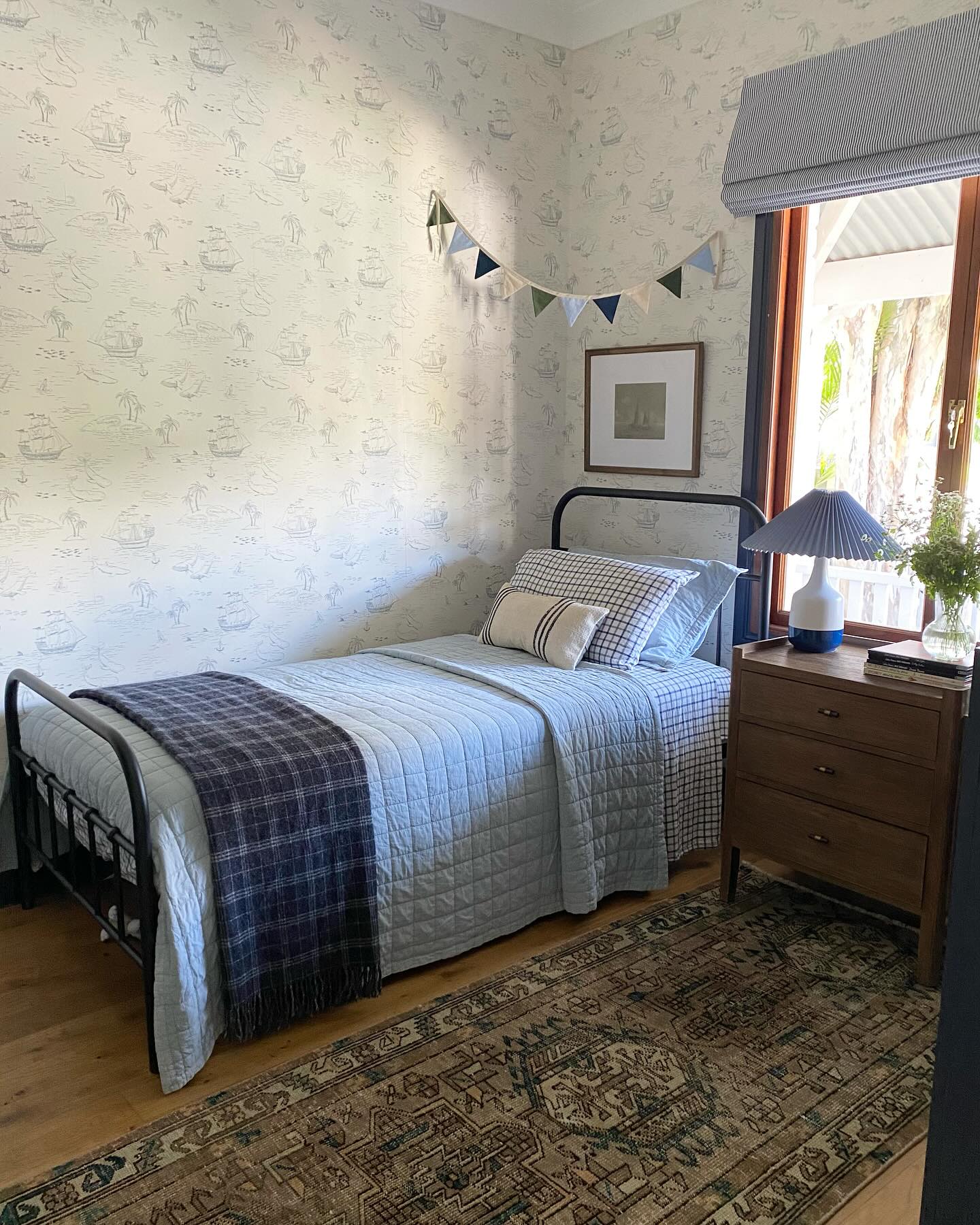 21. Vintage Bedroom with a Sunlit Canopy Bed and Floral Wallpaper
