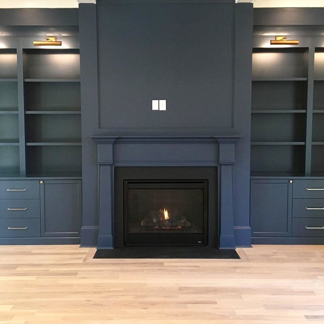 43. Midnight Serenity: a Modern Fireplace Nook with Elegant Storage Solutions