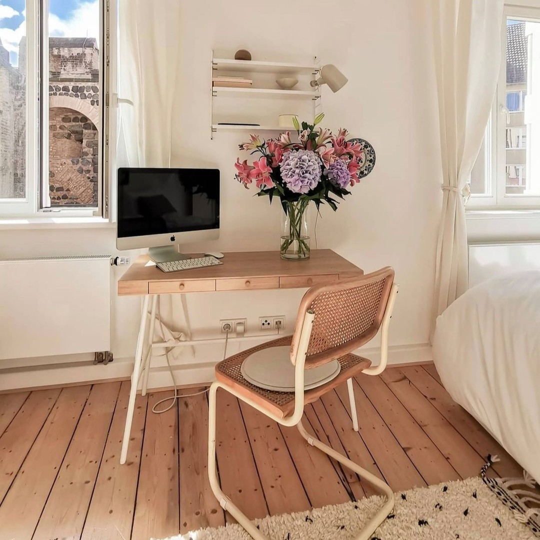 47. Lush Serenity: Merging Minimalist Workspace with Nature’s Palette