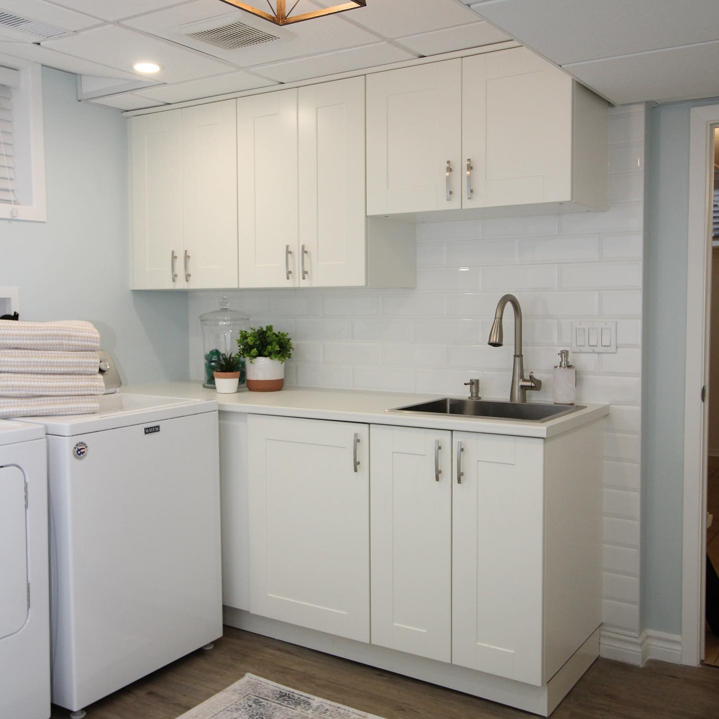 18. a Serene Oasis Of Tidiness: the Chic Basement Laundry Retreat