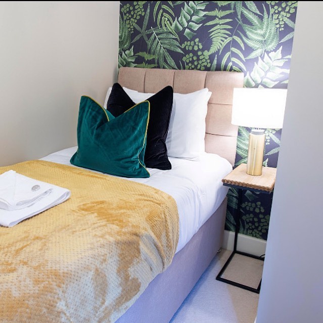 17. Moonlit Serenity: a Bedroom with a Floating Bed and Circular Window Nook