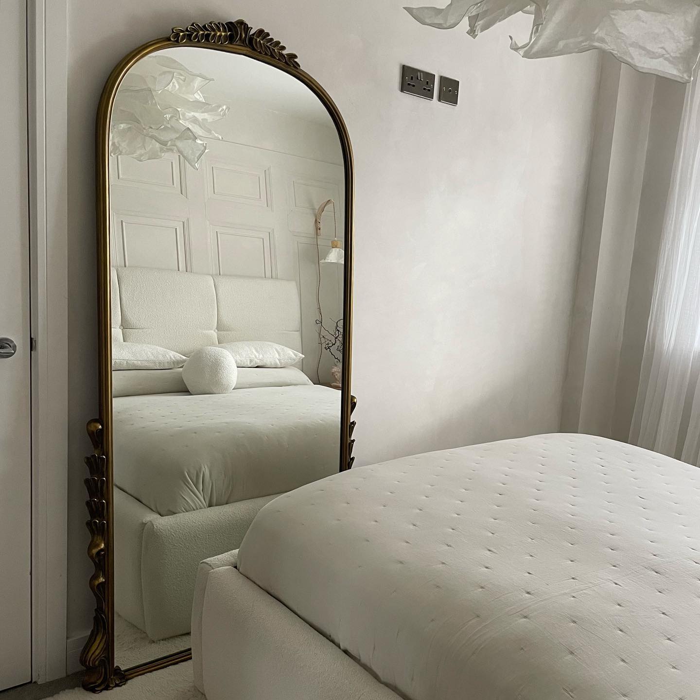 29. Moonlit Reflection on Woven Rattan: a Bedroom Mirror with Natural Charm