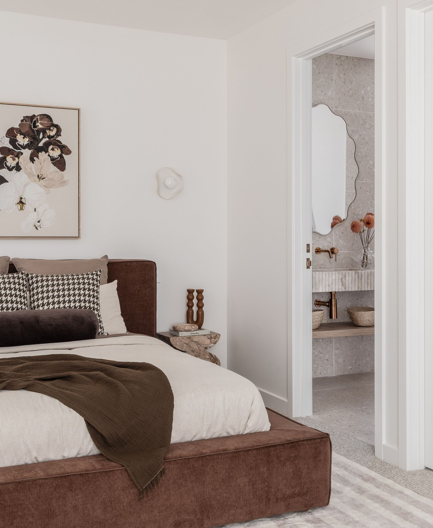 19. a Gilded Sunburst Mirror Reflecting Vintage Charm and Intricate Wallpaper Patterns
