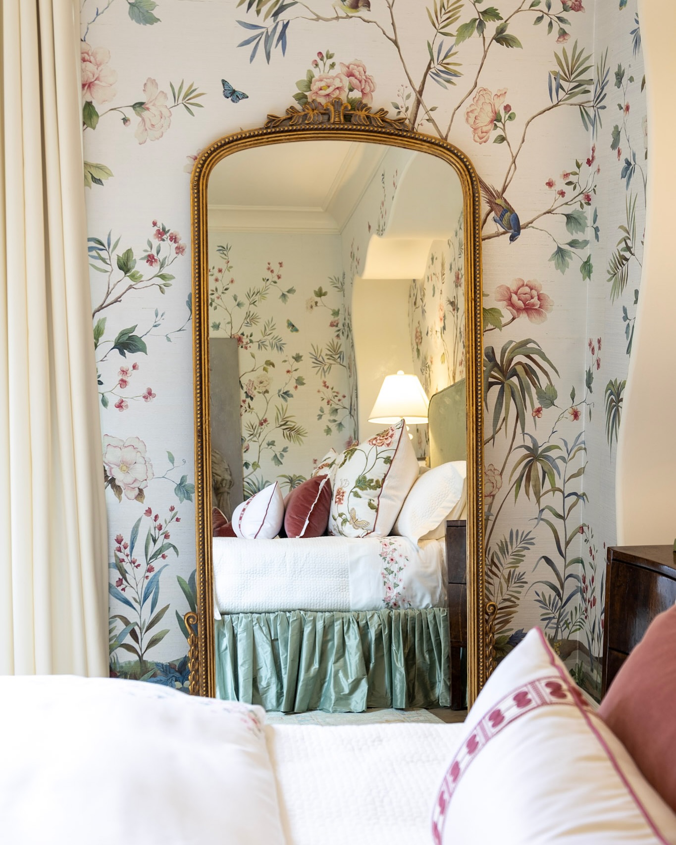 52. Velvet-framed Oval Mirror with Antique Brass Accents Reflecting Timeless Elegance