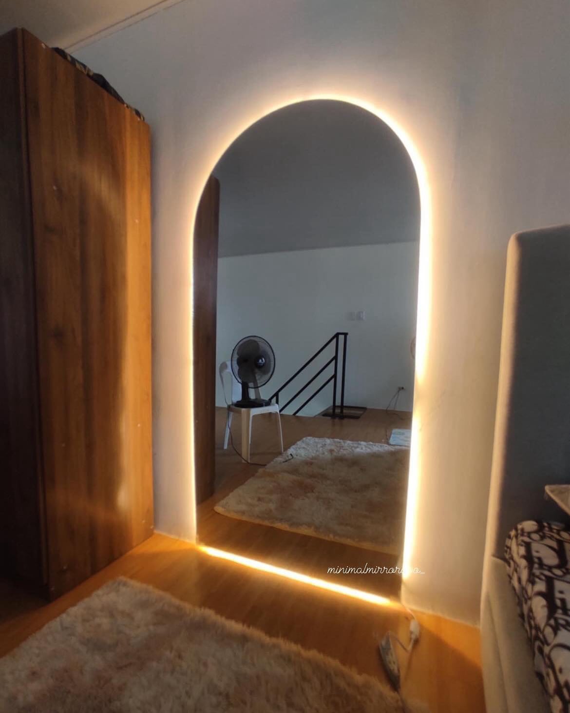 31. Moonlit Oval Mirror with Woven Wicker Frame Reflects Rustic Elegance