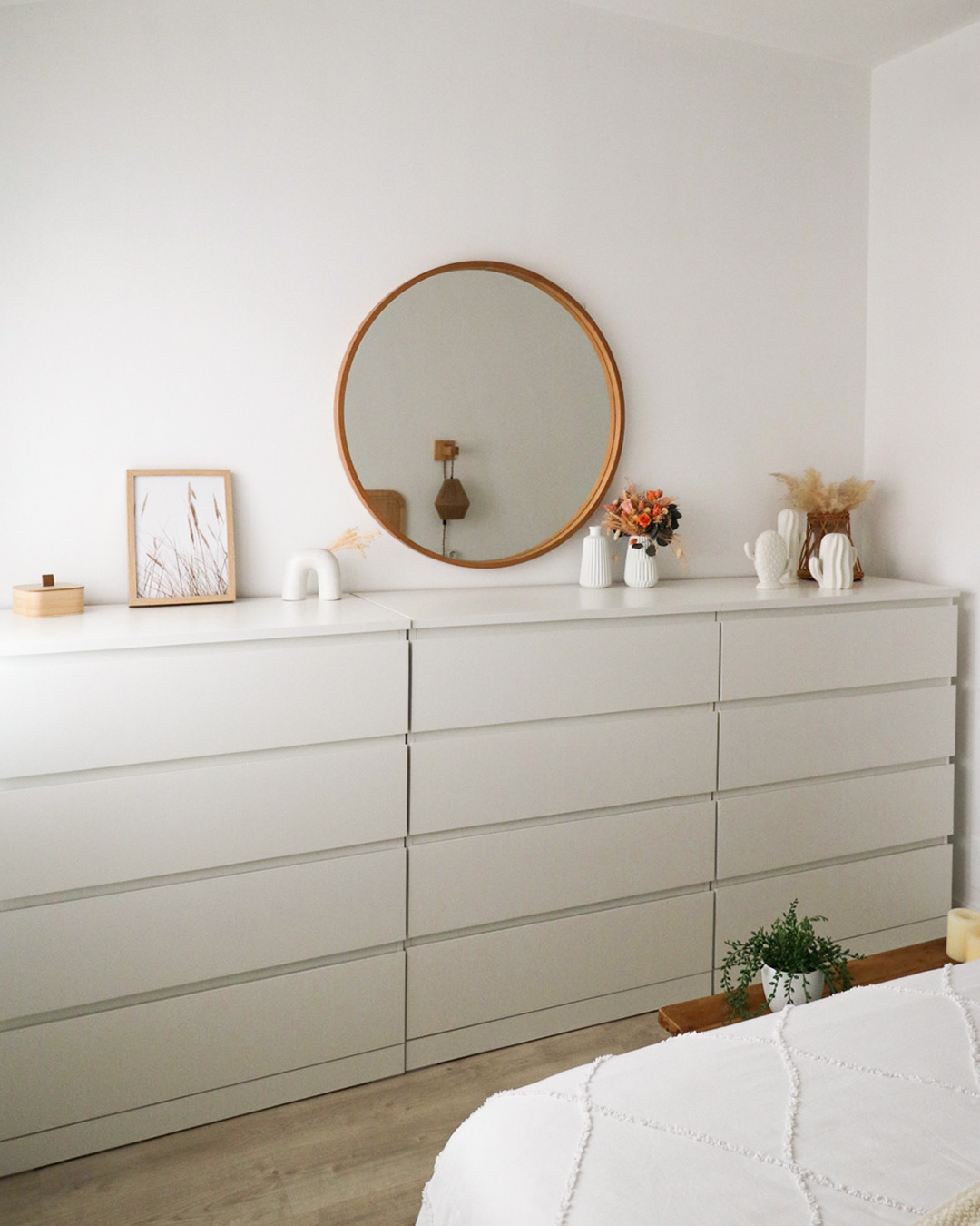 9. Moonlit Reflection: Crescent-shaped Mirror with Floating Shelves and Minimalist Bed Frame