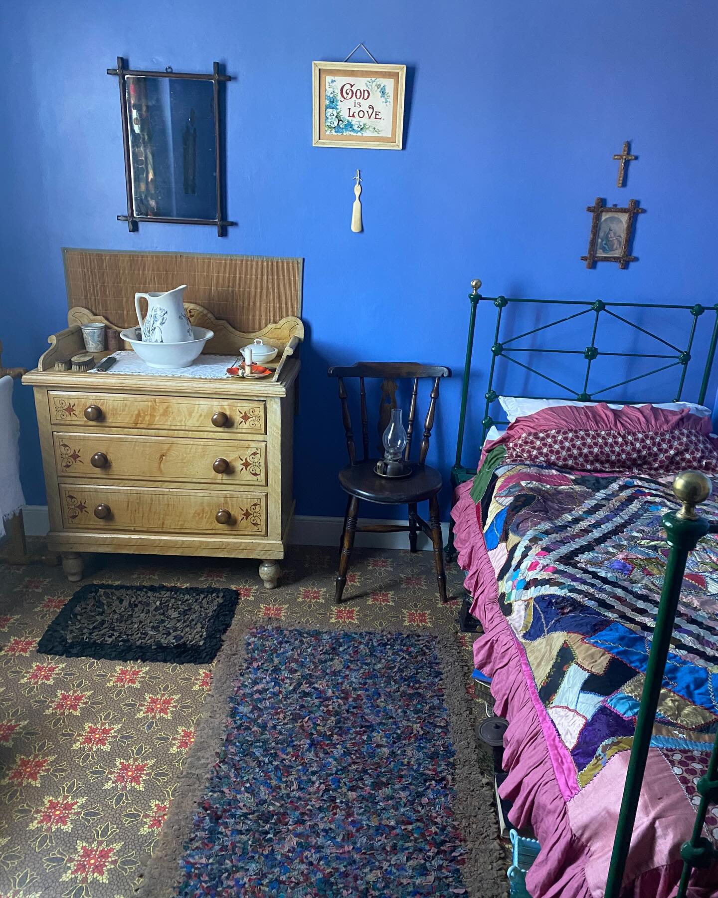 19. Vintage Charm with a Porcelain Doll: a Bedroom with a Hand-painted Headboard and Lace Canopy