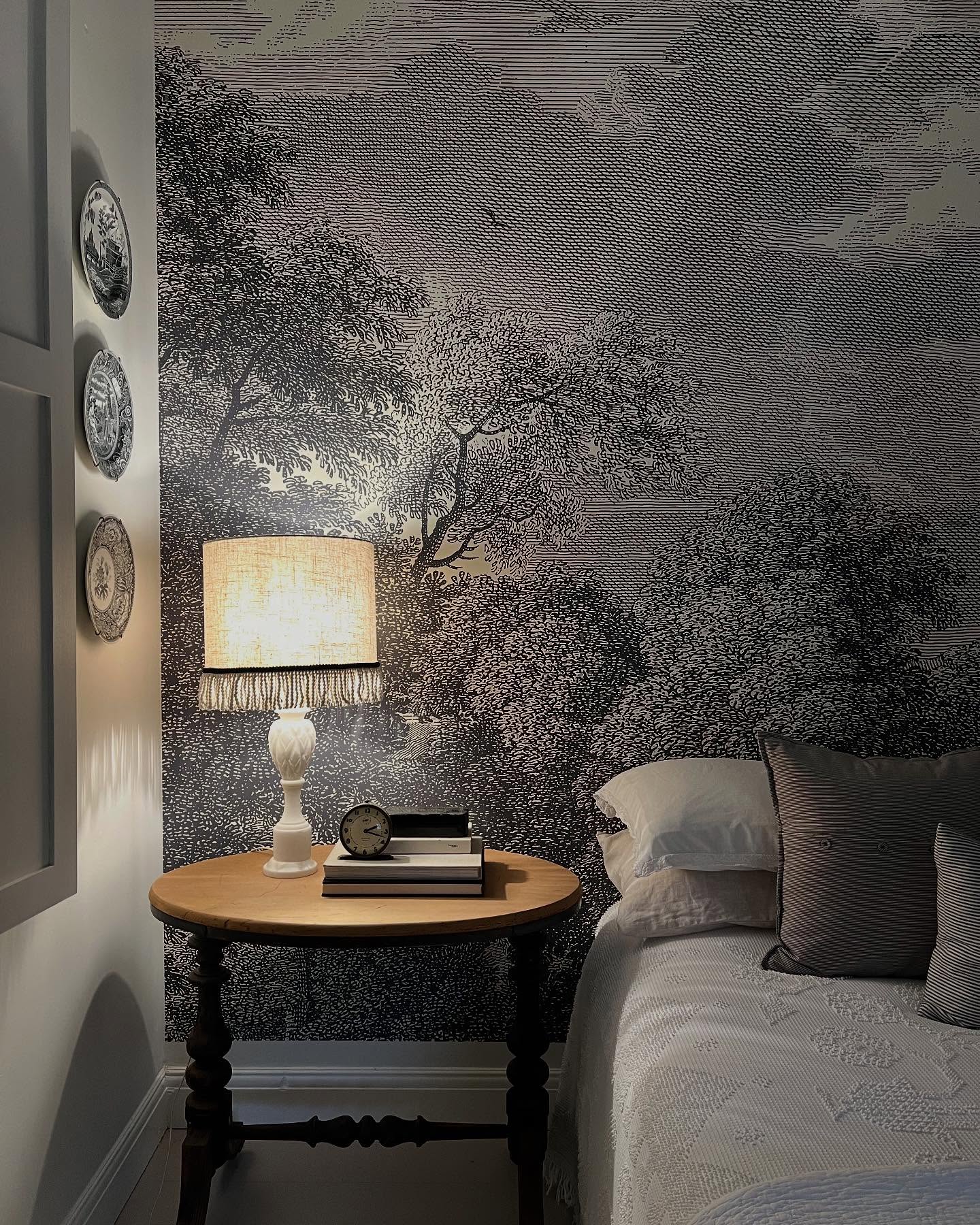 55. the Brass Bedstead with Damask Upholstered Headboard and Amber Glass Lamps