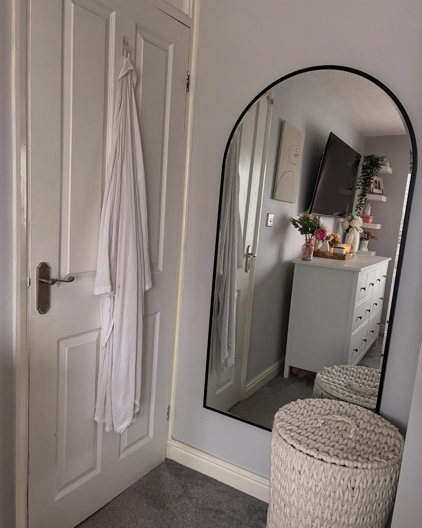 39. Moonlit Reflection: Crescent-shaped Mirror with Starry Accents Above a Vintage Dresser