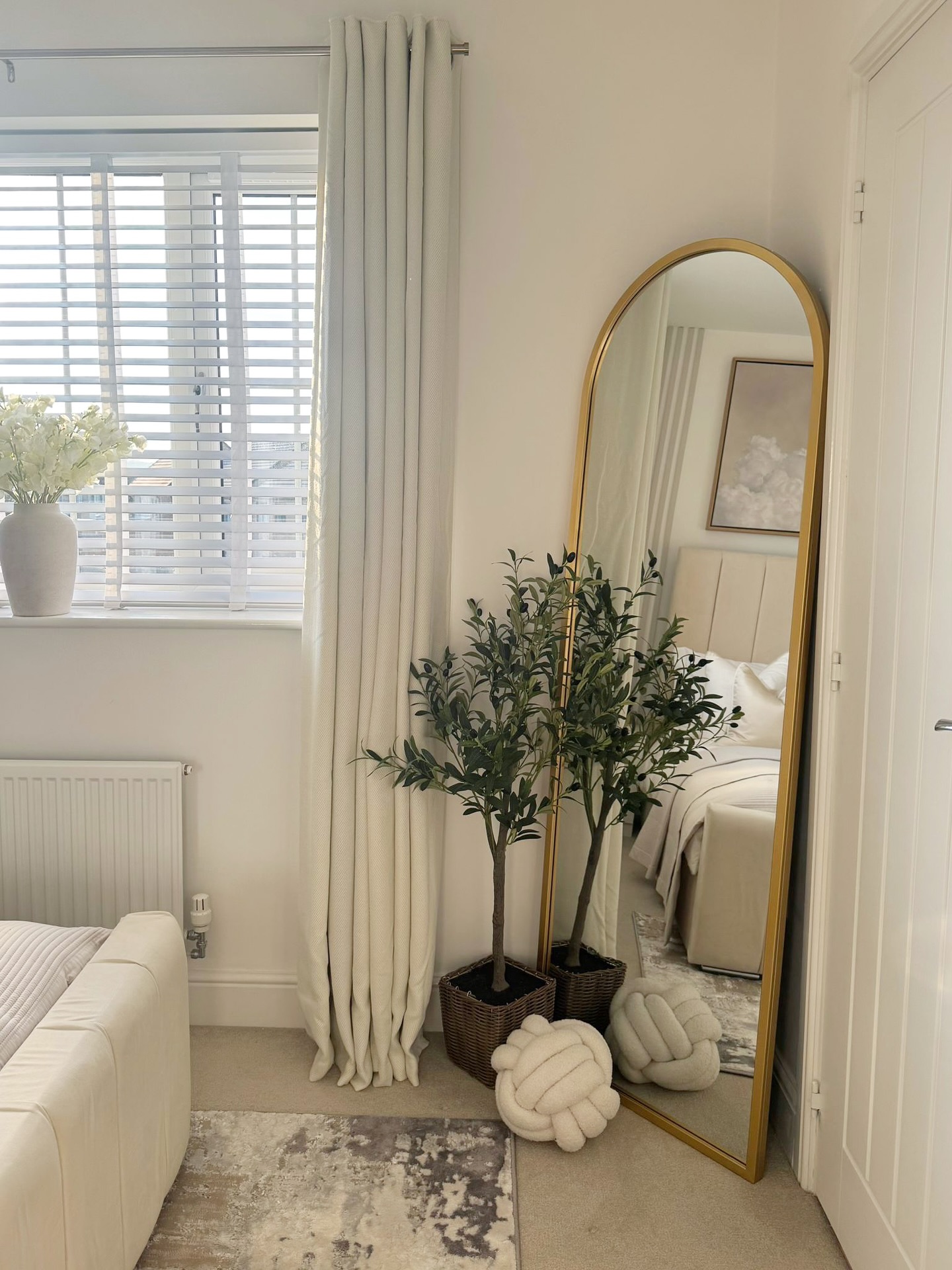 1. Moonlit Reflection: a Crescent-shaped Mirror with Geometric Wall Accents