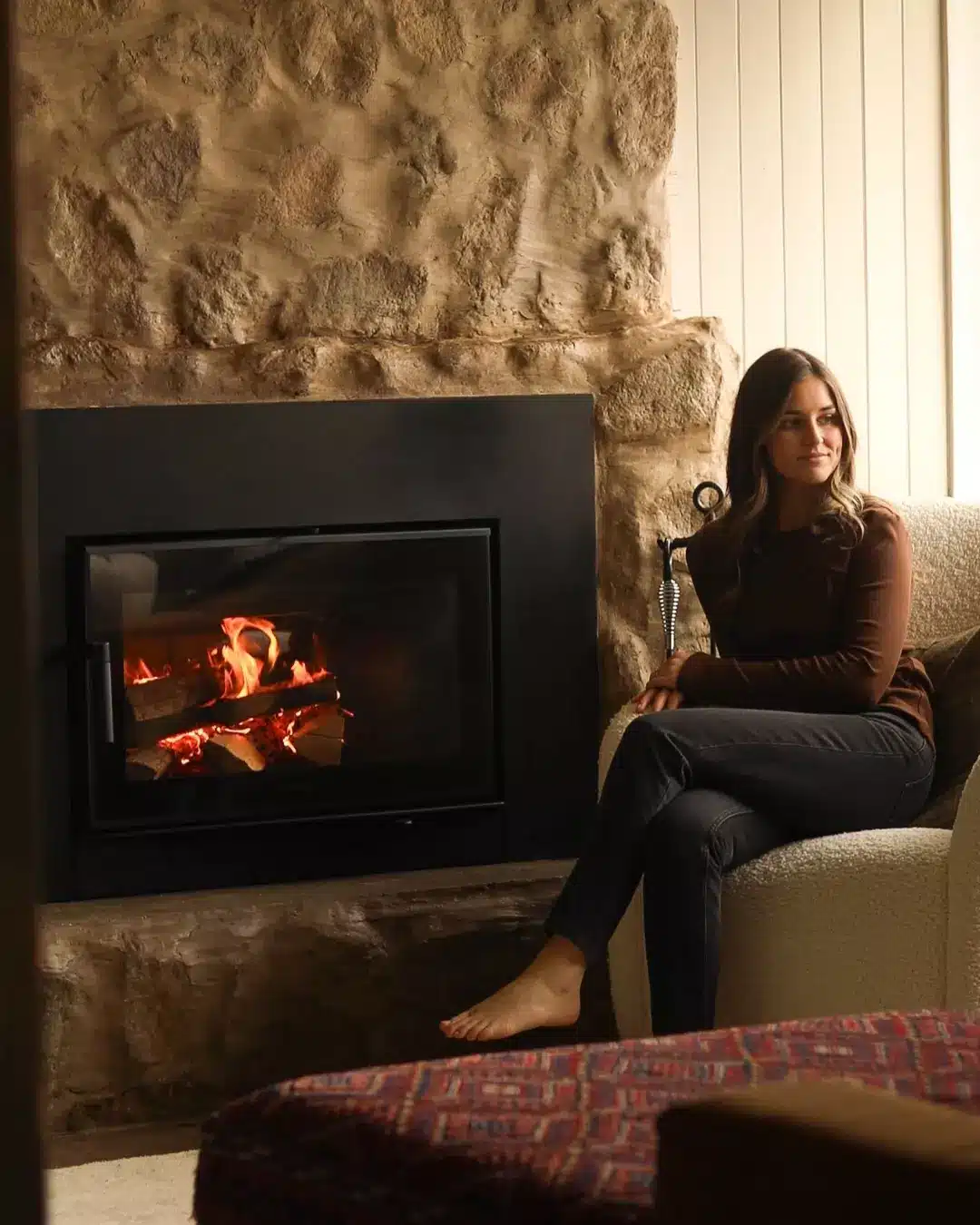 31. Rustic Elegance Meets Cozy Vibes: a Modern Retreat by the Fire