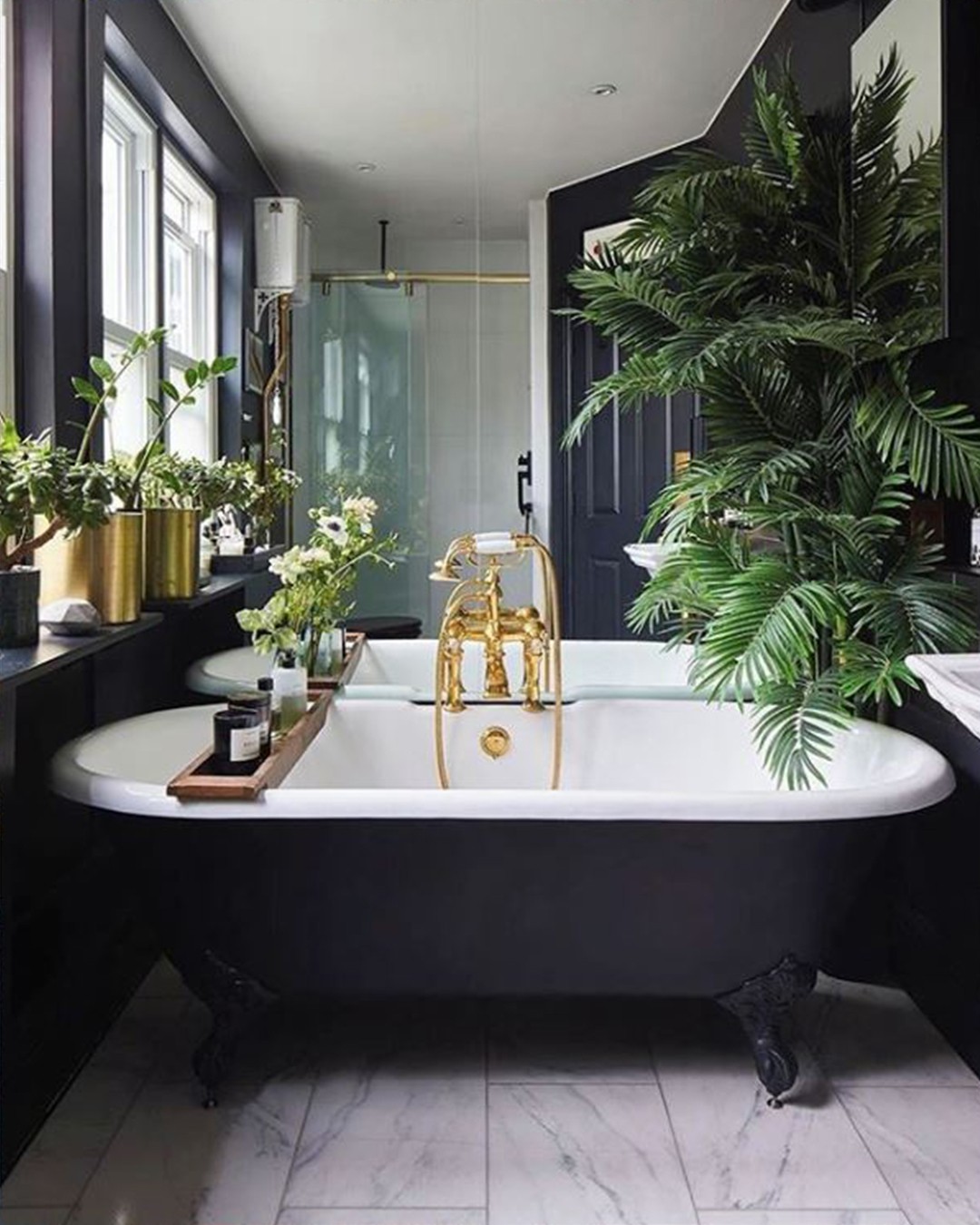 33. Gilded Oasis: Embracing Nature In a Luxe Dark Bathing Retreat