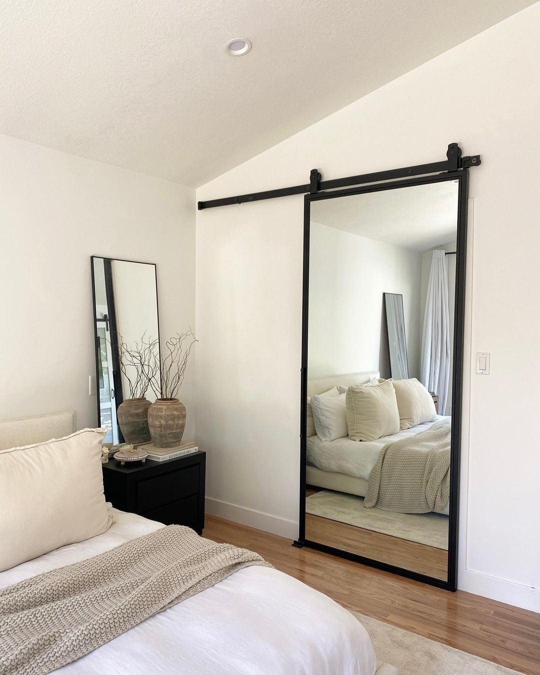 7. Golden Glow Orb Mirror Reflecting Bedroom Serenity