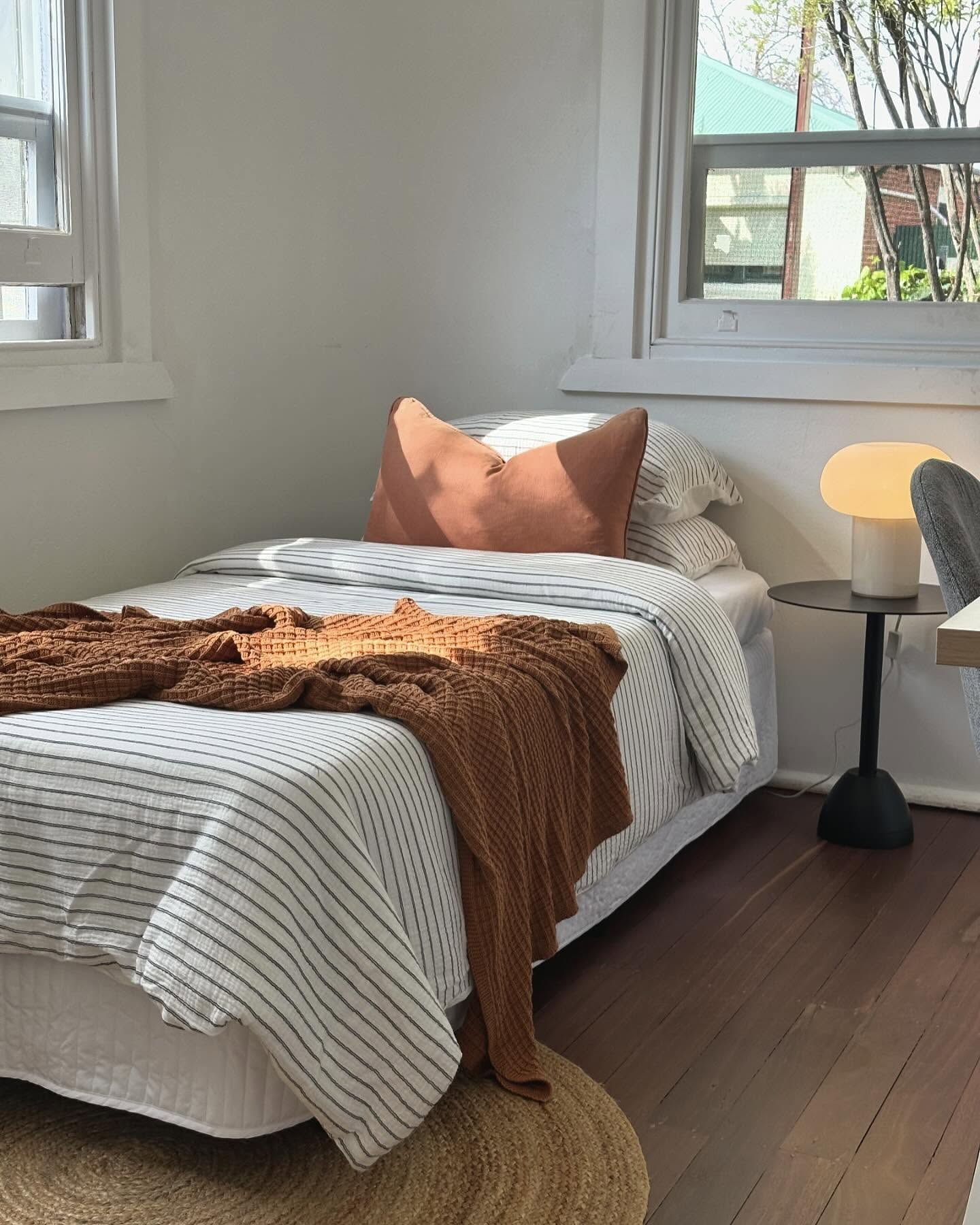 46. Sunlit Serenity: a Canopy Bed with Delicate White Drapes and Soft Green Accents