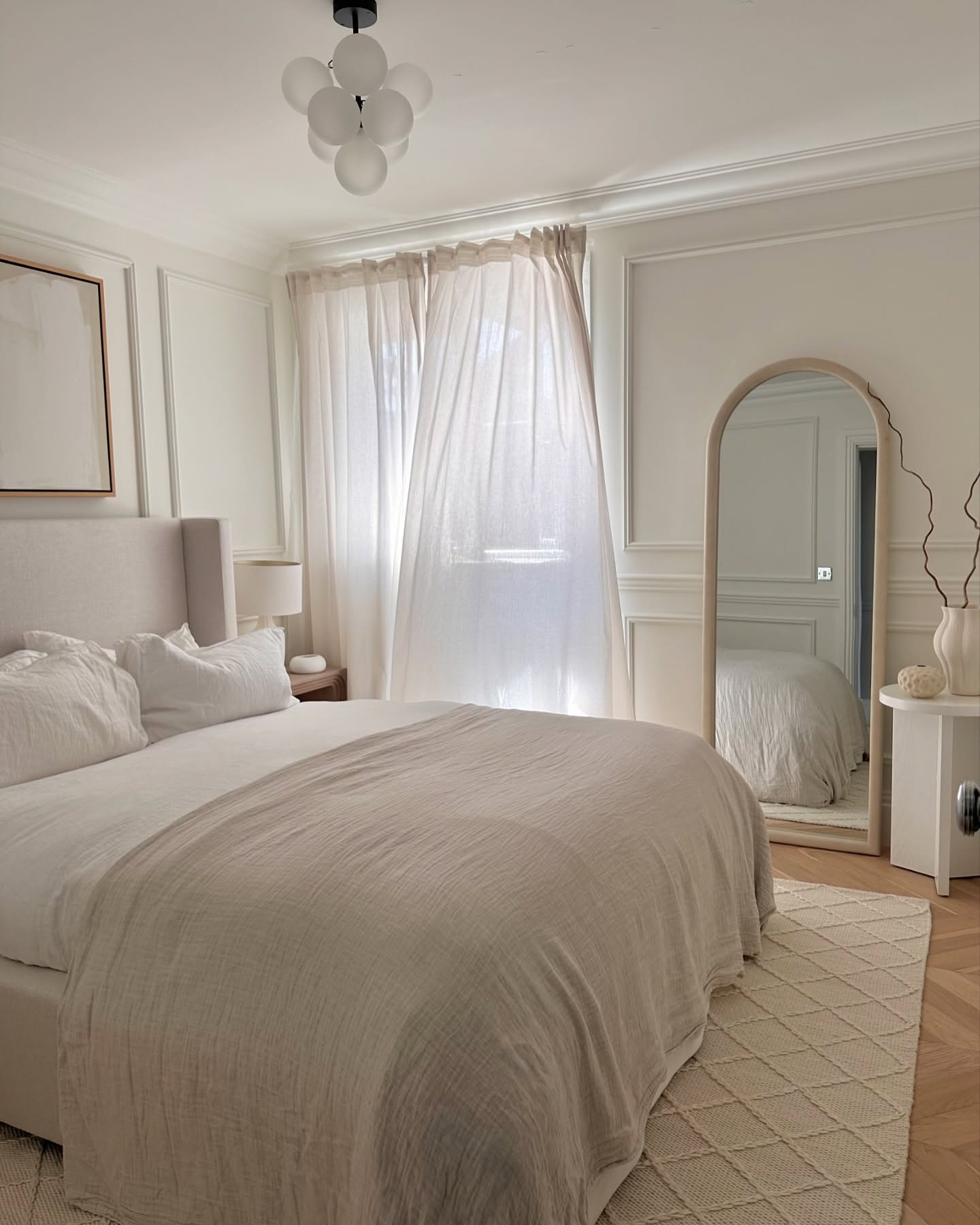40. Moonlit Oval Mirror with Geometric Frame Accents In a Cozy Nook