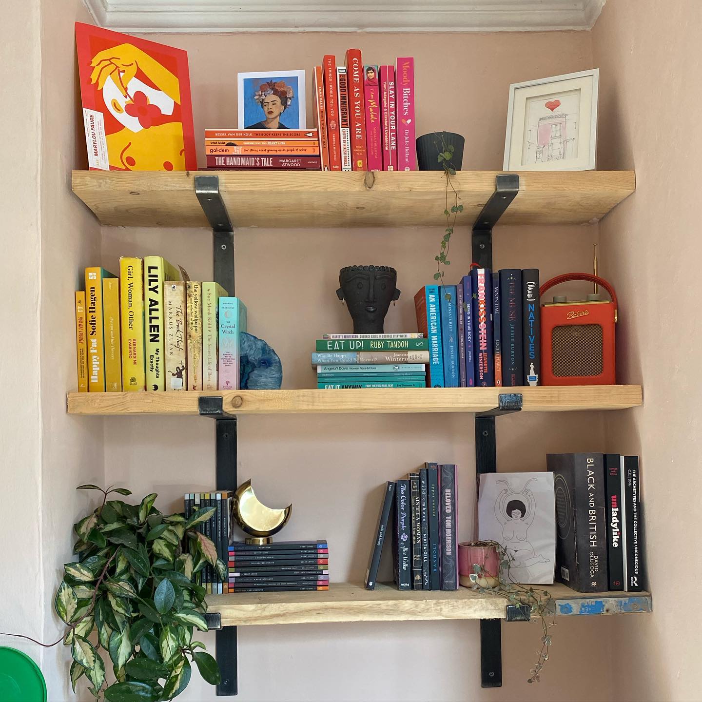 12. Floating Geometric Shelves with Industrial Piping Accents