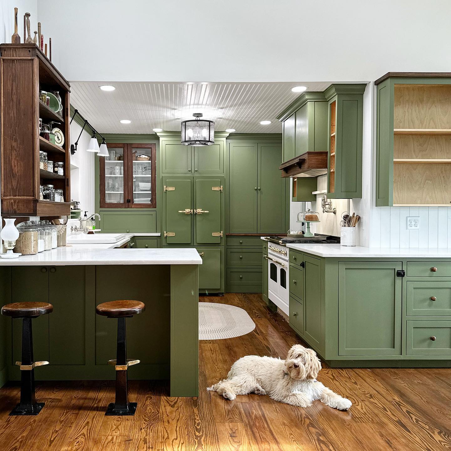 32. Vibrant Avocado Green Cabinets with Geometric Hexagon Backsplash
