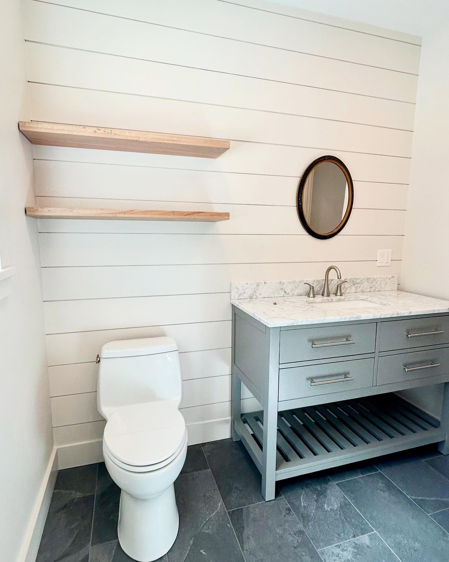 14. Shiplap Serenity with Copper Accents and Geometric Tiling