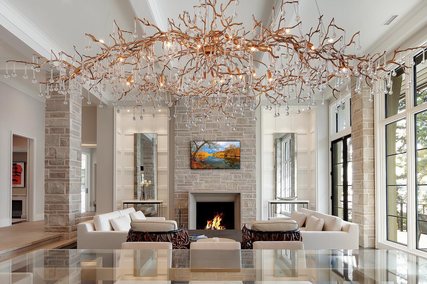 3. the Fusion Of Ferns and Geometric Lines: a Living Room with a Triangular Coffee Table and Lush Greenery