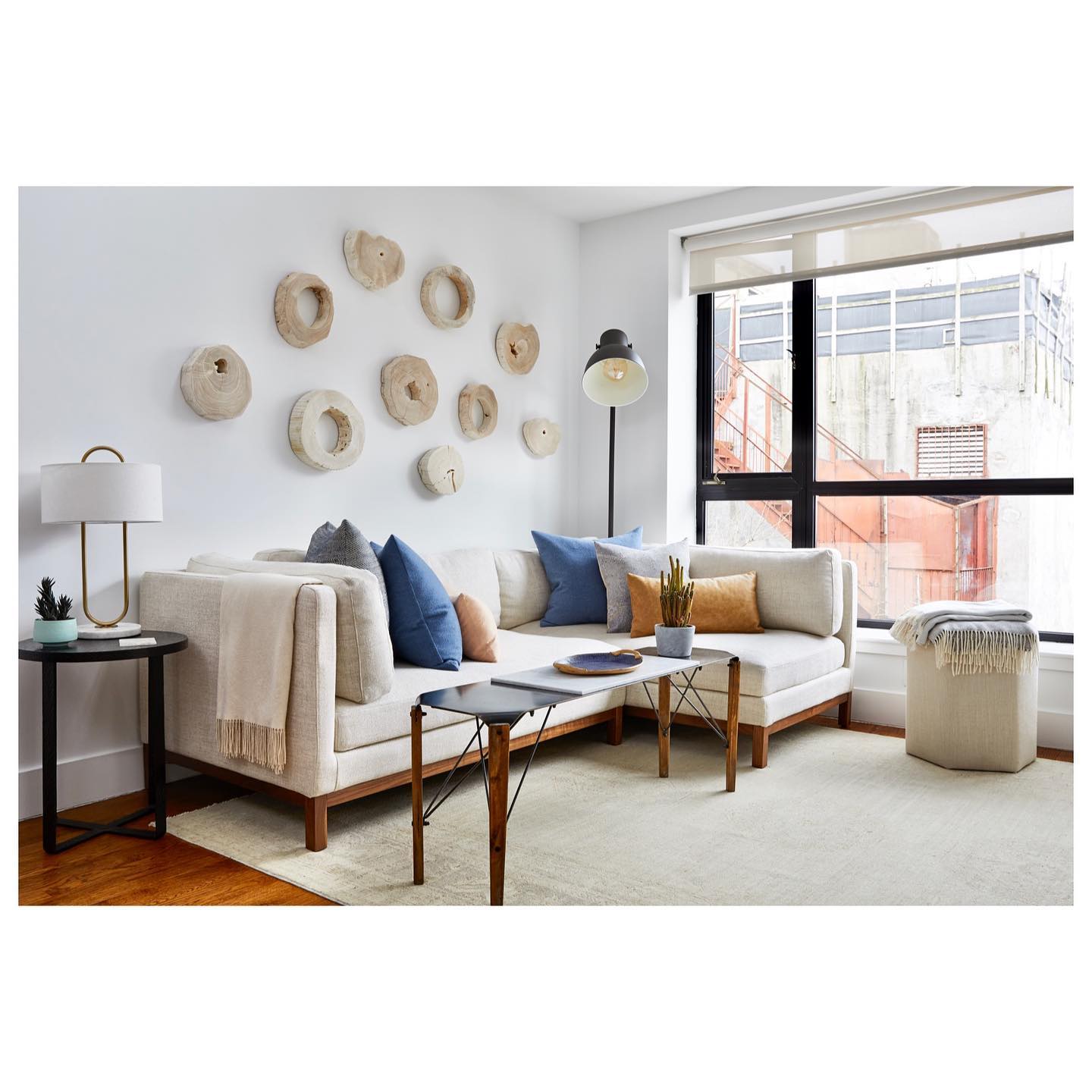 55. a Symphony Of Textures: Woven Baskets and Stone Fireplace In Neutral Harmony
