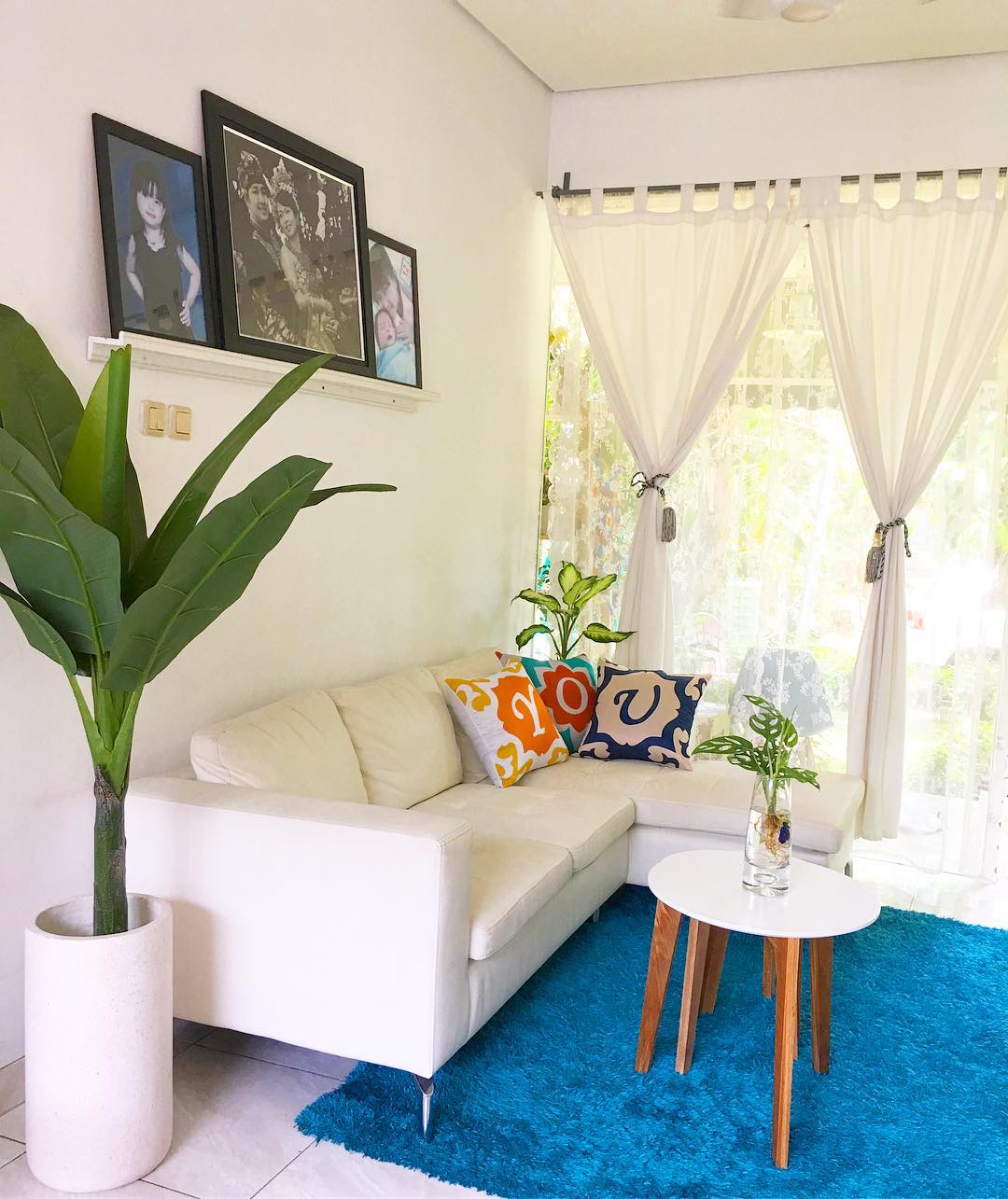 14. the Cobalt Blue Sofa and Geometric Wall Shelves Nook