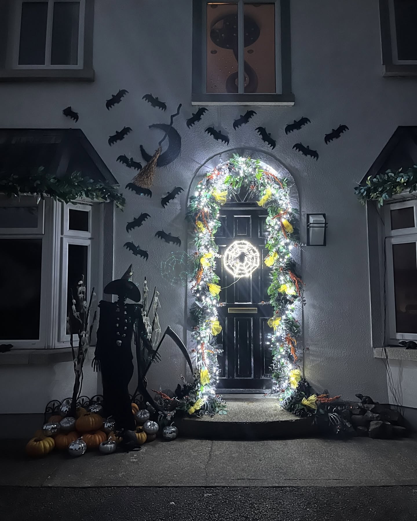 12. a Ghoulishly Grinning Pumpkin Flanked by Cobweb-covered Skeletons