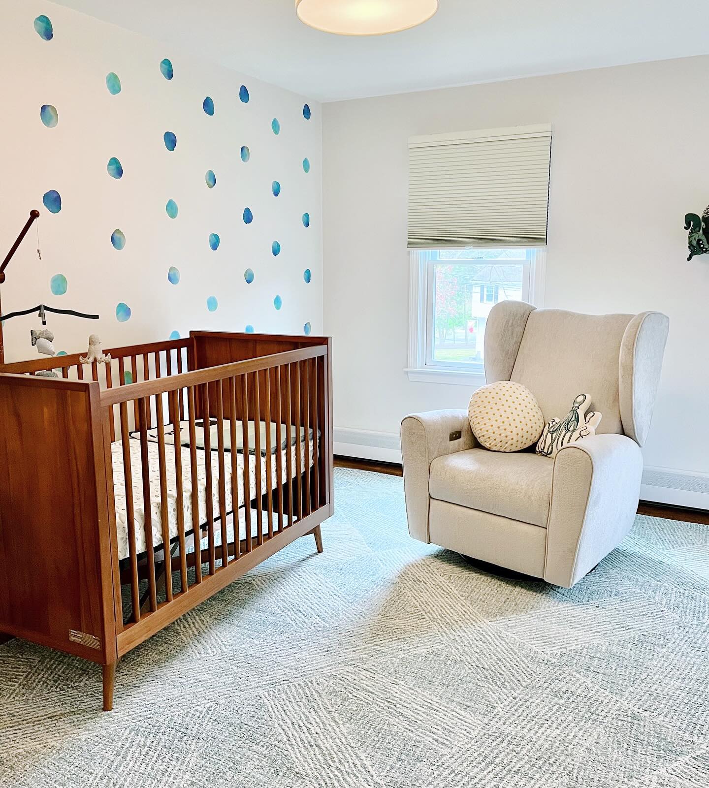 4. Soft Blush and Natural Wood Cradle In a Sunlit Corner