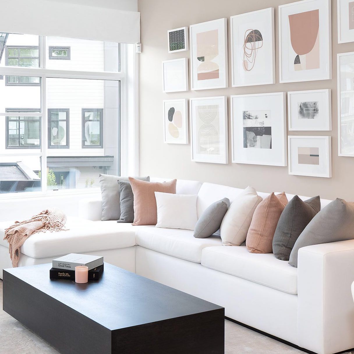 40. a Velvet Armchair Embraced by a Geometric Bookcase and a Gilded Mirror