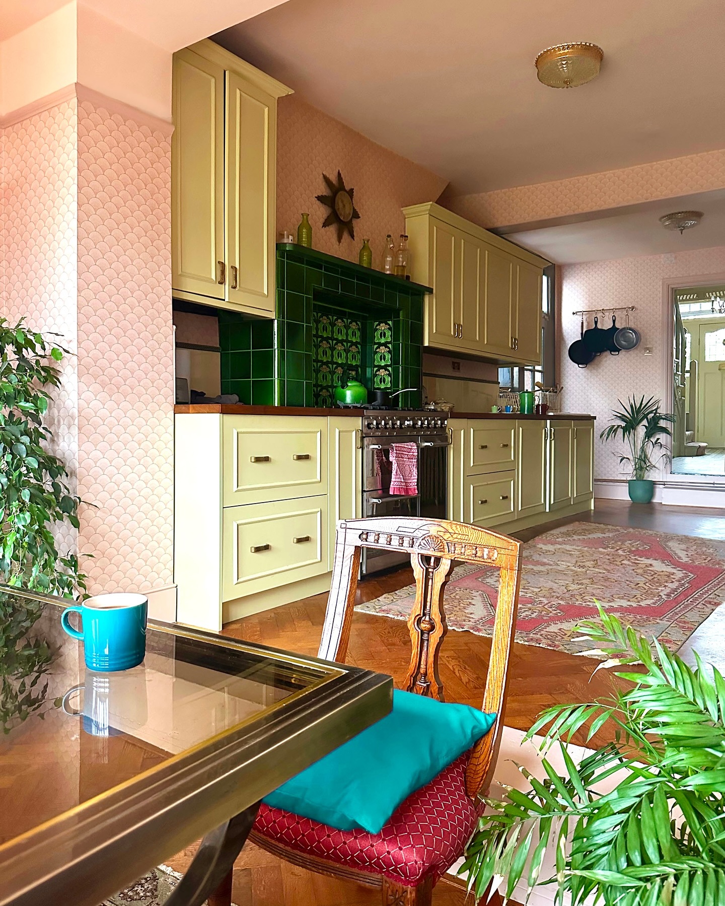 38. Glass Orb Pendant Over Retro Mint Green Stove: a Fusion Of Vintage Charm and Modern Elegance