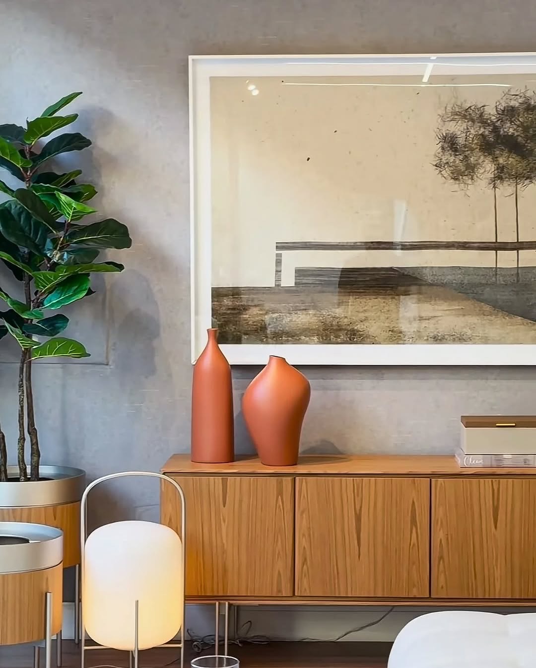 20. Vibrant Geometric Sunburst Mirror with Woven Accent Above a Retro Console