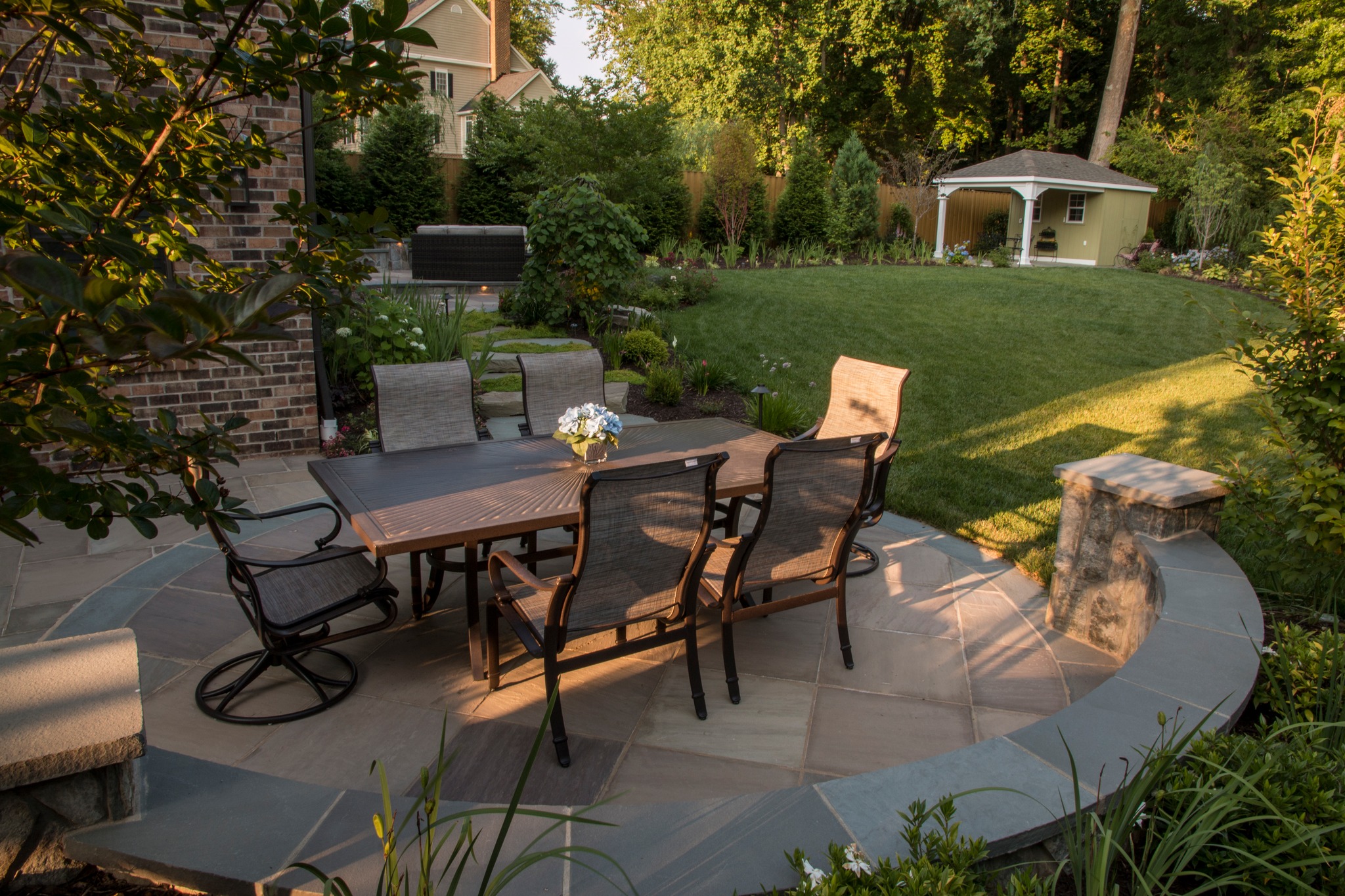 23. Patio Furniture Arrangement with a Zigzag Patterned Rug and Geometric Lanterns