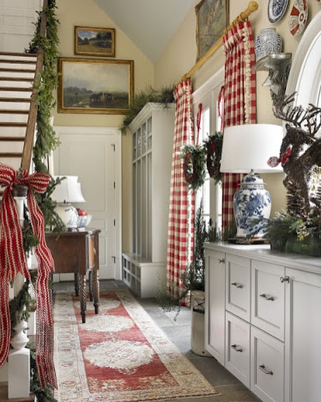 20. Crimson Ribbons and Snowy Pinecones: a Festive Front Door Display