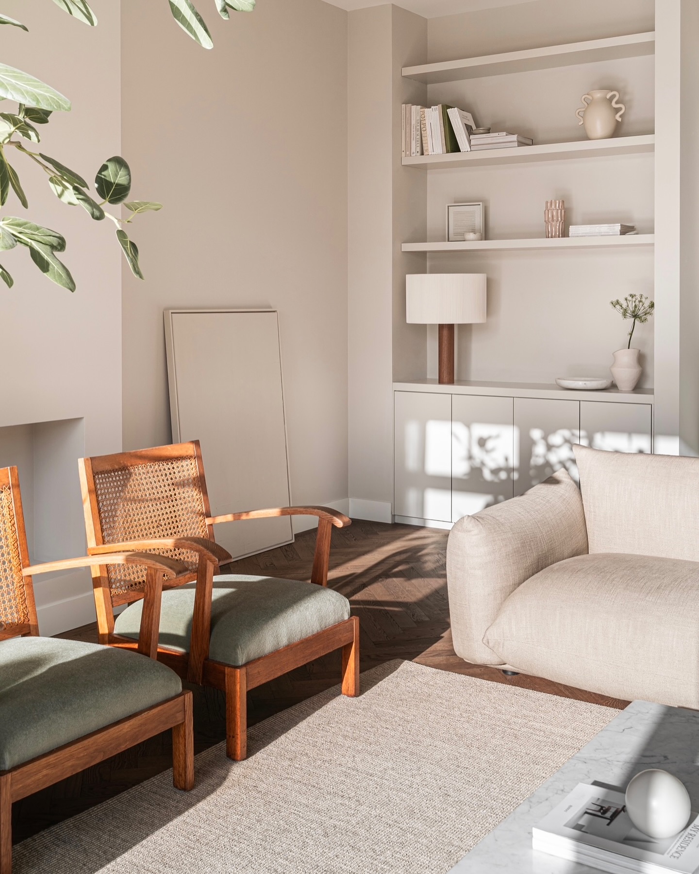 6. Sunlit Alcove Shelving with Botanical Accents and Geometric Tiles