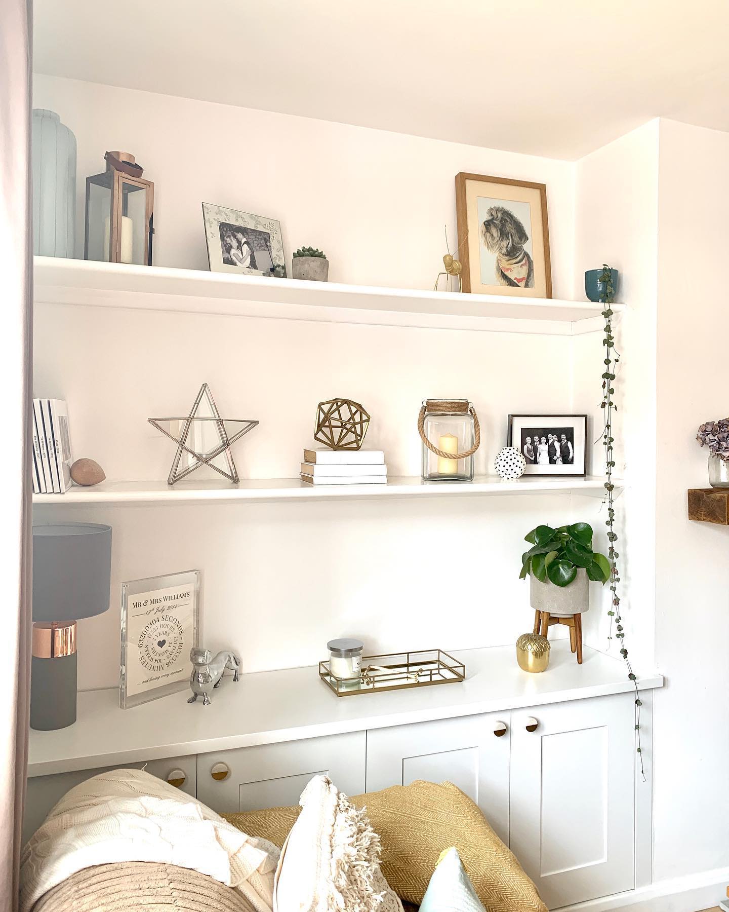 5. Floating Shelves Forming a Geometric Mosaic Above a Minimalist Fireplace