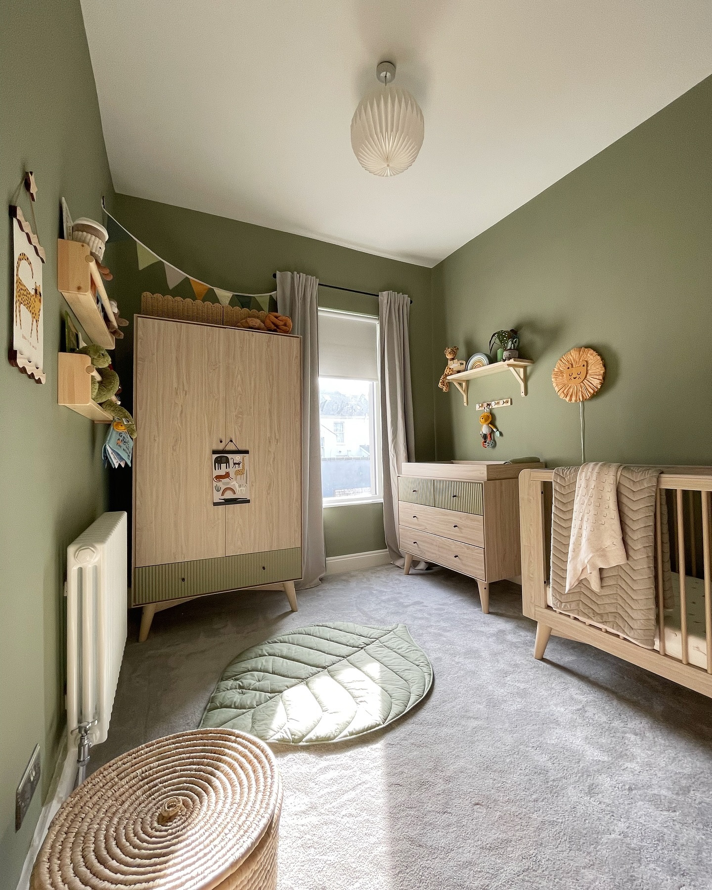 18. the Cradle Of Serenity with a Sage Green Canopy and Woven Basket Accents