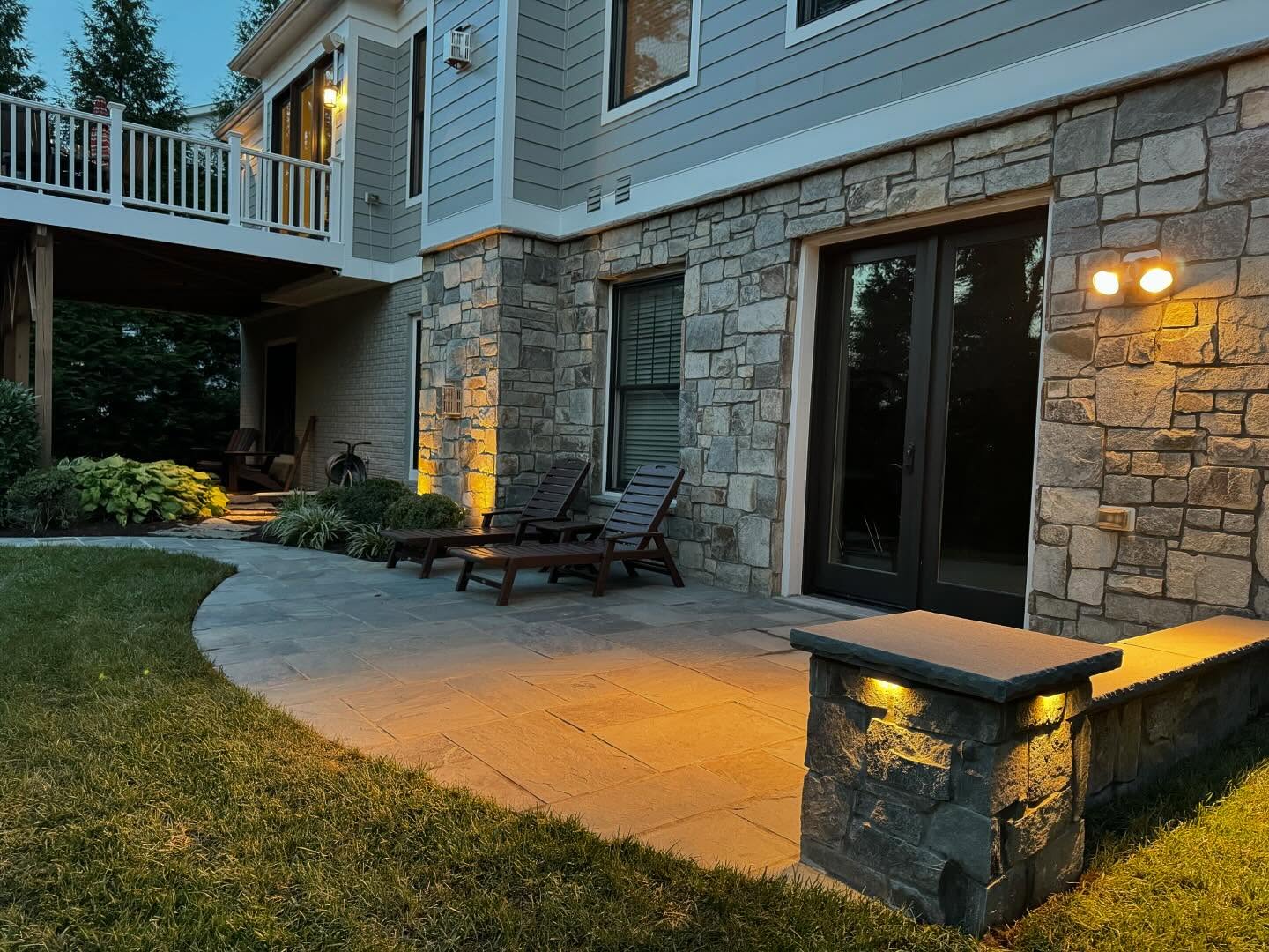 11. Cobblestone Mosaic with Circular Fire Pit and Overarching Pergola