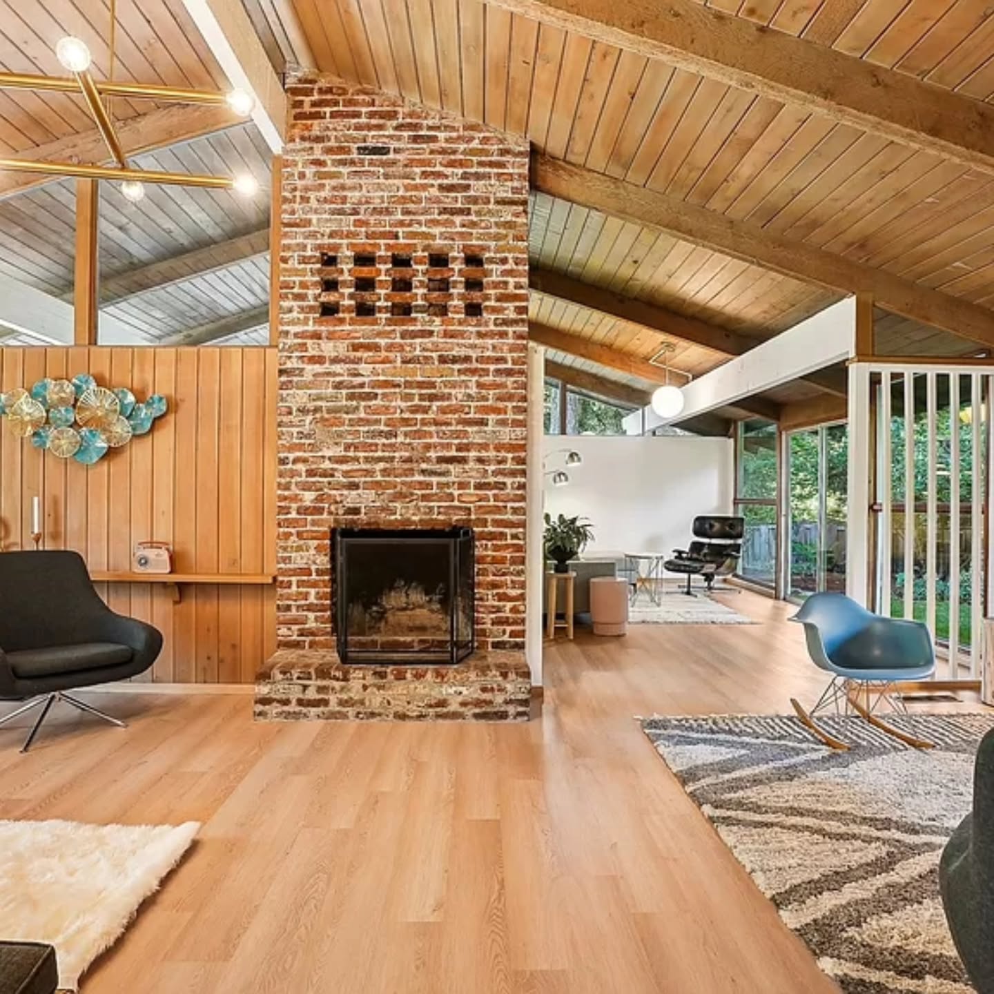 19. Mid-century Marvel: Walnut Veneer and Geometric Brass Accents Fireplace