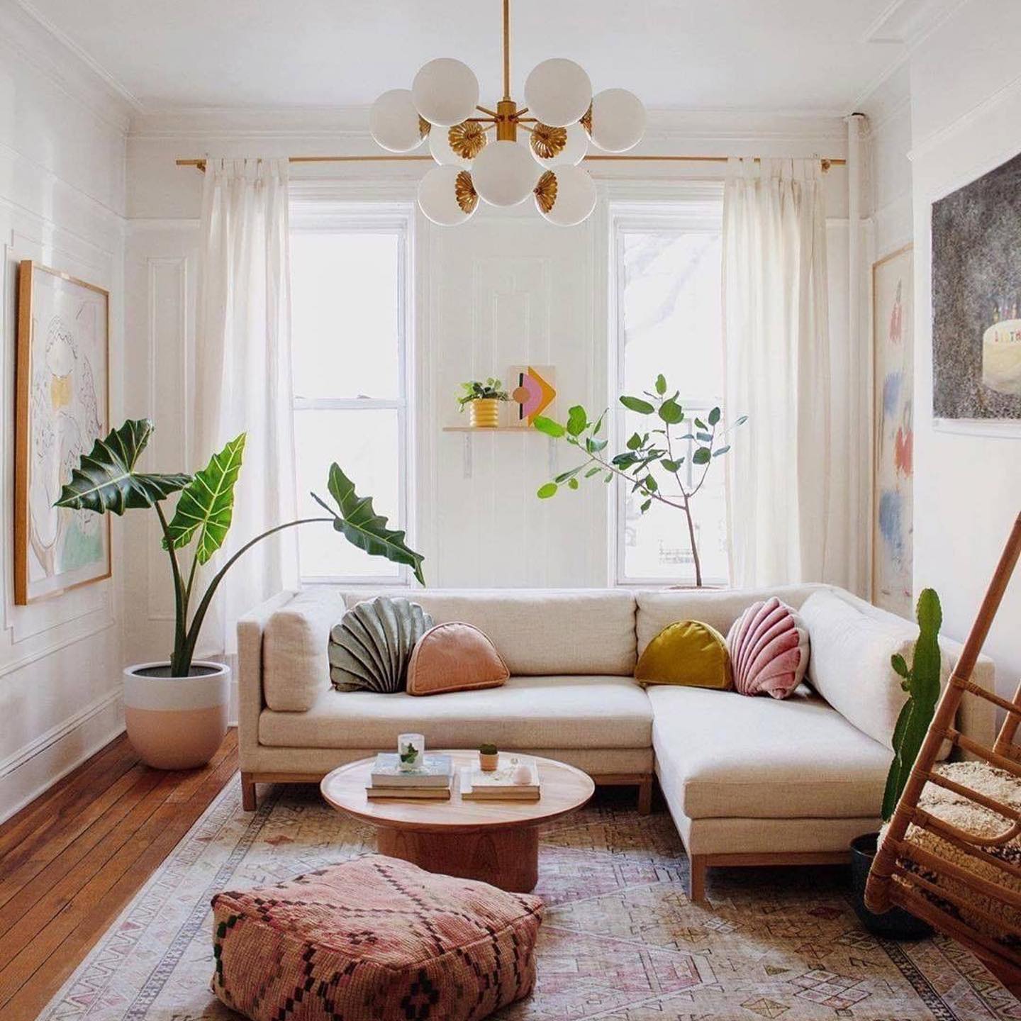 24. Cozy Nook with a Vintage Gramophone and Geometric Pillows on a Rust-colored Sofa