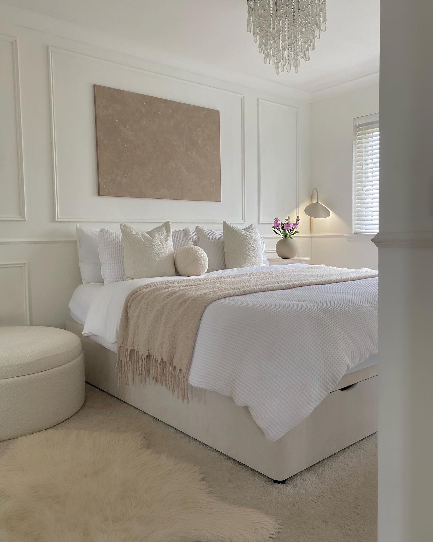 7. Soft Blush and Brass Accents Define This Cozy Nook with a View Of Serenity