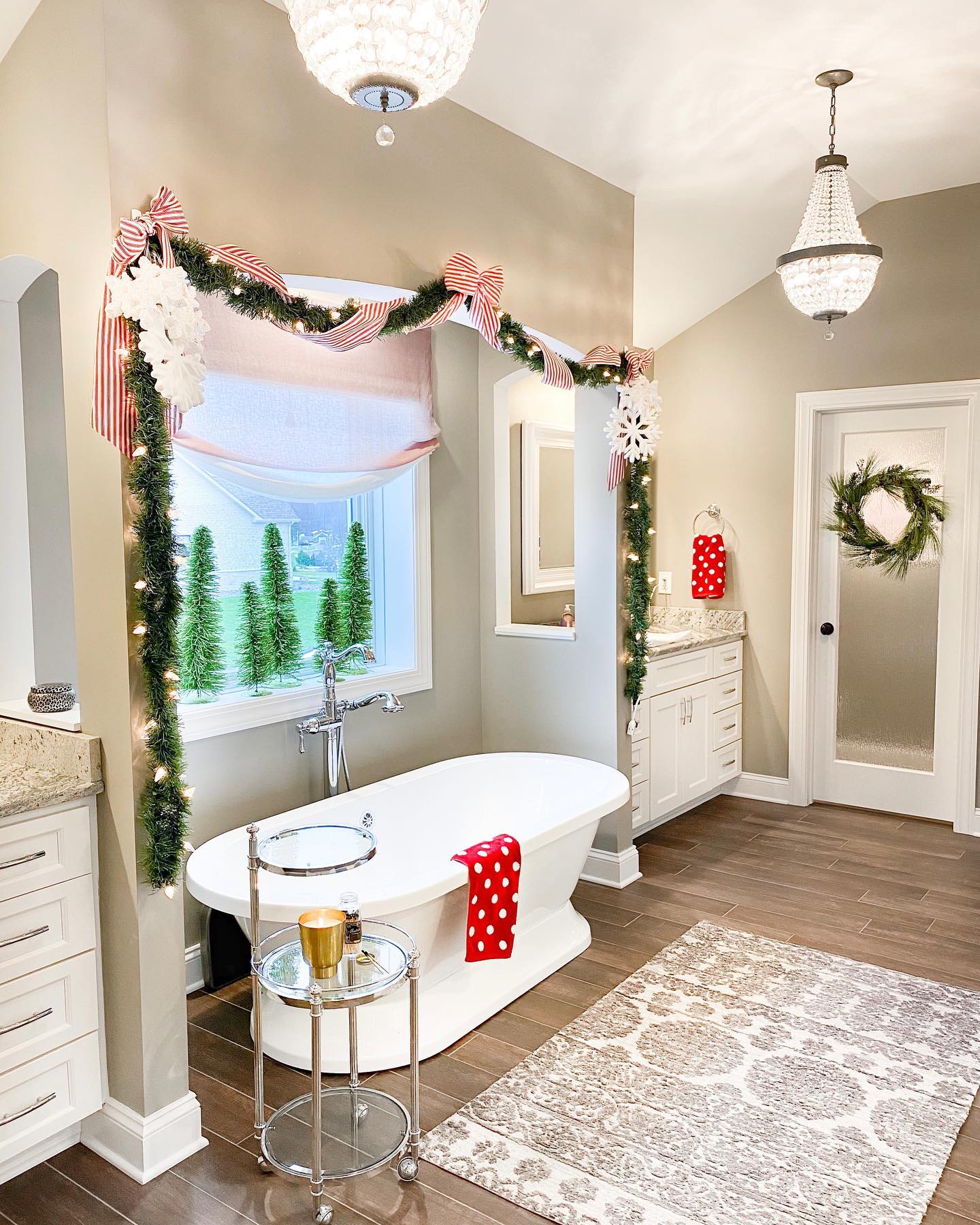 3. Festive Pinecones and Candles on a Marble Vanity with a Single Red Ornament