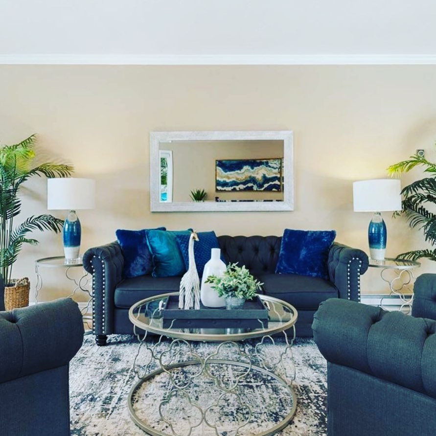 17. the Teal Velvet Sofa and Geometric Gold Mirror Ensemble