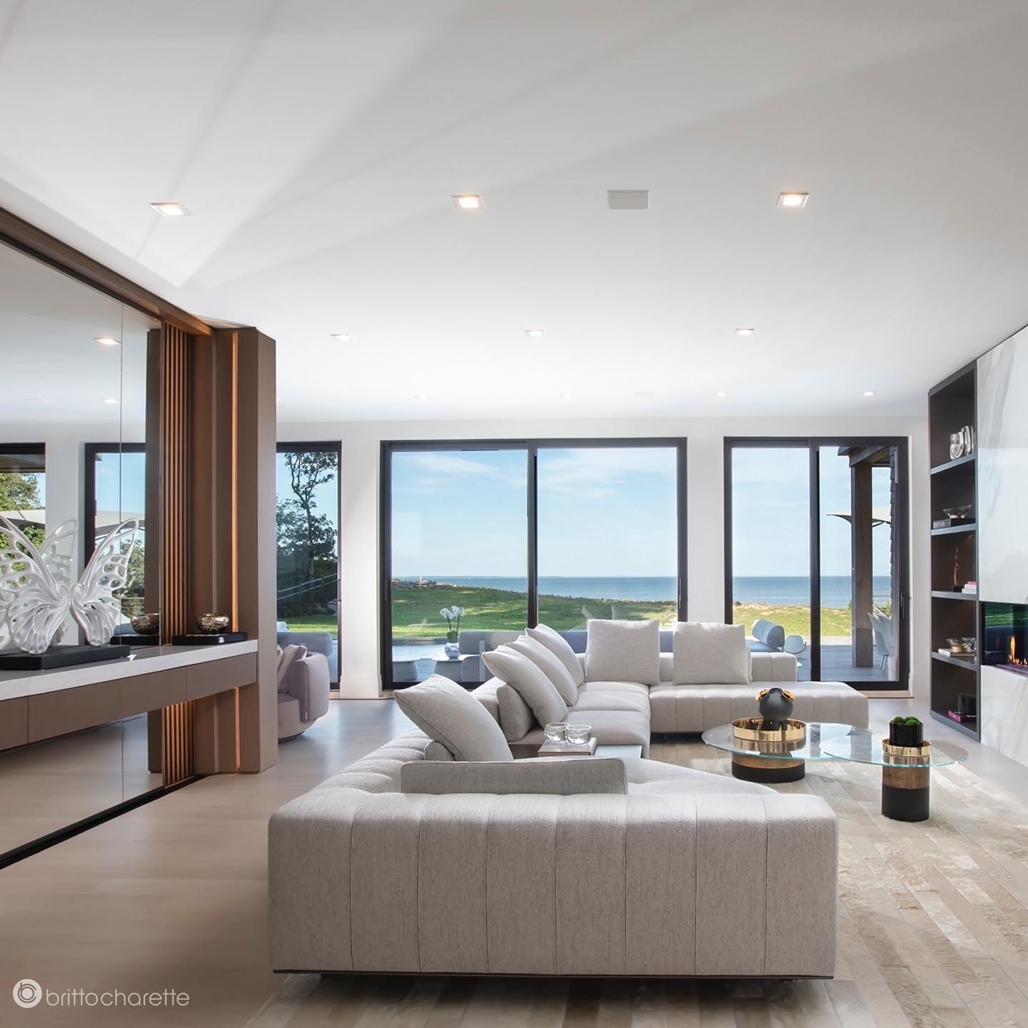 47. the Geometric Fusion Of Emerald and Ebony: a Living Room with Angular Sofas and Monstera Leaves