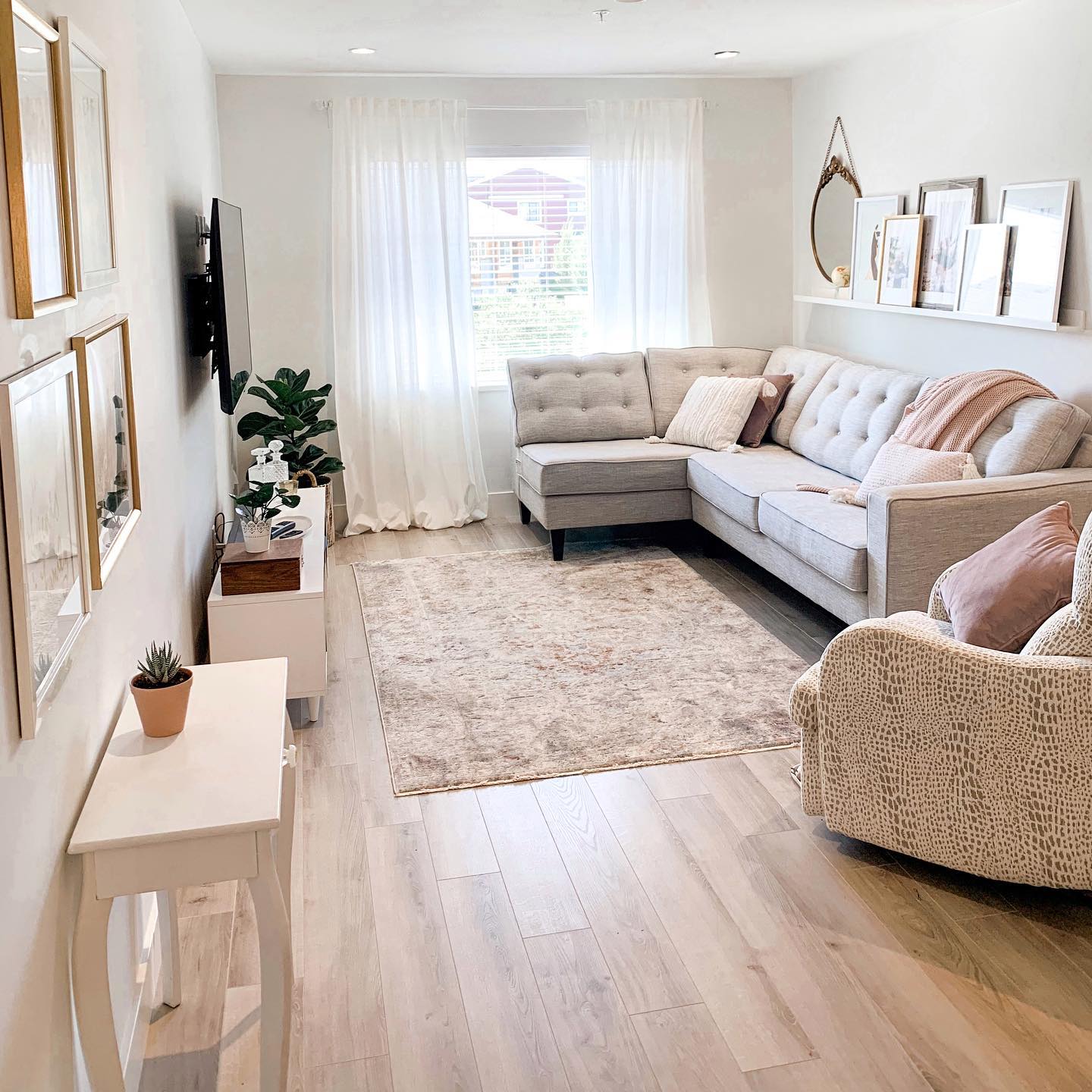 27. Sunlit Serenity: a Floating Shelf with Geometric Vases and Greenery Above a Pale Blue Couch